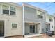 Exterior back of the townhome with a sliding glass door and vinyl siding at 1728 Devon Sw Dr, Atlanta, GA 30311