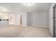 Large, carpeted basement with sliding door access to the outdoors and an open layout at 1728 Devon Sw Dr, Atlanta, GA 30311