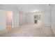 Spacious basement featuring carpet, a sliding glass door leading outside, and access to other areas at 1728 Devon Sw Dr, Atlanta, GA 30311