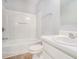 Bathroom features a shower-tub combo and vanity with sink at 1728 Devon Sw Dr, Atlanta, GA 30311