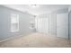 Large bedroom with carpet, neutral walls, and a closet at 1728 Devon Sw Dr, Atlanta, GA 30311