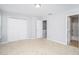 Bright bedroom with neutral colored walls and carpeted floors at 1728 Devon Sw Dr, Atlanta, GA 30311