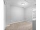 This carpeted bedroom has neutral walls and ceiling light fixture at 1728 Devon Sw Dr, Atlanta, GA 30311