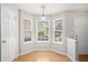 Cozy breakfast nook with wood floors, bright windows, and ample natural light at 1728 Devon Sw Dr, Atlanta, GA 30311