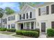 Charming townhome featuring a welcoming entrance, well-maintained landscaping, and classic architectural details at 1728 Devon Sw Dr, Atlanta, GA 30311