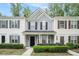 Inviting townhome with neutral siding, black shutters, and manicured landscaping, enhancing curb appeal at 1728 Devon Sw Dr, Atlanta, GA 30311