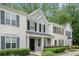 Attractive townhome featuring multiple windows, tidy landscaping, and a well-kept facade at 1728 Devon Sw Dr, Atlanta, GA 30311