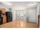 Charming breakfast nook featuring hardwood floors, bright windows, and adjacent kitchen appliances at 1728 Devon Sw Dr, Atlanta, GA 30311