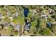 Stunning aerial view of a property featuring mature trees, a tranquil river, and a sparkling blue swimming pool at 2750 Interlaken Dr, Marietta, GA 30062