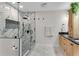 Beautiful bathroom featuring a marble walk-in shower, hexagon tile floor, and granite countertop at 2750 Interlaken Dr, Marietta, GA 30062