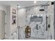 Bathroom featuring a glass enclosed shower with marble tile and built-in shelving at 2750 Interlaken Dr, Marietta, GA 30062