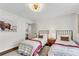 Cozy bedroom featuring two twin beds, modern decor, and an inviting atmosphere at 2750 Interlaken Dr, Marietta, GA 30062