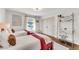 Sunlit bedroom with hardwood floors, modern décor, and dual beds perfect for siblings at 2750 Interlaken Dr, Marietta, GA 30062