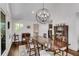 Dining room featuring hardwood floors and modern spherical chandelier at 2750 Interlaken Dr, Marietta, GA 30062