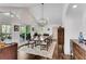 Bright dining room with hardwood floors, vaulted ceiling, and views of nature at 2750 Interlaken Dr, Marietta, GA 30062
