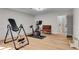 Home gym and exercise space featuring an exercise bike and inversion table at 2750 Interlaken Dr, Marietta, GA 30062