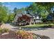 Beautiful home with water access, lush landscaping, and a charming stone driveway at 2750 Interlaken Dr, Marietta, GA 30062