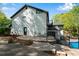 Exterior of a modern home with a walkout patio, second-story balcony, and wrought iron fencing at 2750 Interlaken Dr, Marietta, GA 30062