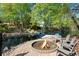 Lakeside backyard featuring a fire pit and private dock at 2750 Interlaken Dr, Marietta, GA 30062
