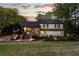 Charming home with stone accents, landscaped yard, and inviting front porch offers curb appeal and welcomes visitors at 2750 Interlaken Dr, Marietta, GA 30062
