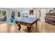 Spacious game room with backyard views, pool access, and a ping pong table for recreation at 2750 Interlaken Dr, Marietta, GA 30062