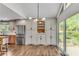 Open kitchen with stainless appliances, ample storage, and view of the backyard at 2750 Interlaken Dr, Marietta, GA 30062