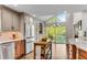 Modern kitchen with stainless steel appliances and a large window overlooking the water at 2750 Interlaken Dr, Marietta, GA 30062