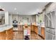 Updated kitchen boasts stainless steel appliances, wooden cabinets, and lots of storage at 2750 Interlaken Dr, Marietta, GA 30062