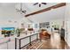 Spacious living room with vaulted ceilings, wood beams, and a cozy fireplace at 2750 Interlaken Dr, Marietta, GA 30062