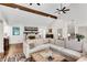 Bright and airy living room with a fireplace, large sectional sofa, and hardwood floors at 2750 Interlaken Dr, Marietta, GA 30062