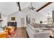 Open-concept living room with high ceilings, wood beams, and stylish furniture at 2750 Interlaken Dr, Marietta, GA 30062