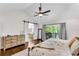 Main bedroom featuring hardwood floors, sliding barn doors, and a private balcony at 2750 Interlaken Dr, Marietta, GA 30062