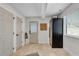 Well-lit mudroom featuring tile flooring, storage cabinets, and access to the backyard at 2750 Interlaken Dr, Marietta, GA 30062