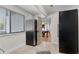 View from mudroom to game room featuring large windows and tiled floors at 2750 Interlaken Dr, Marietta, GA 30062