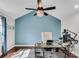 Comfortable office with vaulted ceiling, modern lighting, and hardwood floors at 2750 Interlaken Dr, Marietta, GA 30062