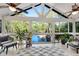 Bright sunroom with tile floors and walls of windows providing beautiful lake views at 2750 Interlaken Dr, Marietta, GA 30062