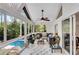 Cozy sunroom with a comfortable seating area and views of the pool and backyard at 2750 Interlaken Dr, Marietta, GA 30062