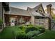Well-manicured backyard with outdoor kitchen, dining area, lush greenery and stone accents at 2979 Ridgewood Nw Rd, Atlanta, GA 30327