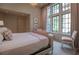 Inviting bedroom with large windows, light pink curtains, comfortable bed, and neutral color scheme at 2979 Ridgewood Nw Rd, Atlanta, GA 30327