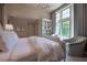 Bright bedroom features a large bed, window, and light color scheme at 2979 Ridgewood Nw Rd, Atlanta, GA 30327