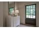 Chic entryway showcasing a modern cabinet, decorative mirror, and stylish lighting at 2979 Ridgewood Nw Rd, Atlanta, GA 30327