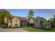 Stunning stone home featuring a shake roof, manicured lawn, and a circular driveway surrounded by mature trees at 2979 Ridgewood Nw Rd, Atlanta, GA 30327