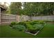 Beautifully landscaped garden with manicured hedges, lush greenery and stone accents, adding elegance at 2979 Ridgewood Nw Rd, Atlanta, GA 30327