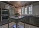 Chef's kitchen with custom cabinets, large island, and stainless steel appliances offers a gourmet cooking experience at 2979 Ridgewood Nw Rd, Atlanta, GA 30327