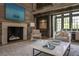 Elegant living room with a stone fireplace, comfortable seating, and a soaring ceiling for an open, airy feel at 2979 Ridgewood Nw Rd, Atlanta, GA 30327