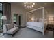 Elegant main bedroom with a four-poster bed, soft neutral tones, and a decorative chandelier at 2979 Ridgewood Nw Rd, Atlanta, GA 30327