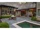 Beautiful backyard pool and patio with stone pavers and lush landscaping create a serene outdoor space at 2979 Ridgewood Nw Rd, Atlanta, GA 30327
