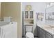 Bathroom with tile floors, vanity with drawers, and a toilet with built-in storage at 363 Arnold Mill Rd, Woodstock, GA 30188