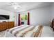Spacious bedroom featuring a dresser, large window, and a neutral color palette at 363 Arnold Mill Rd, Woodstock, GA 30188