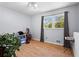 Spare bedroom with a large window, neutral walls, and hardwood floors at 363 Arnold Mill Rd, Woodstock, GA 30188